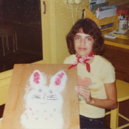 Young Lisa Rinna showing her easter bunny.